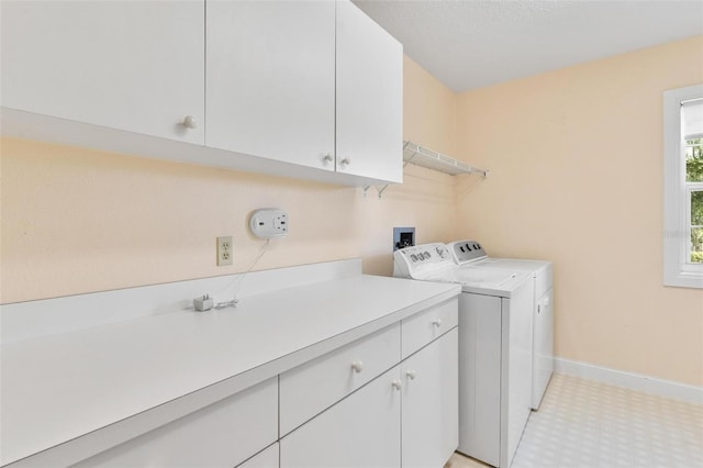 9223 Silver Lake Dr, Leesburg, FL 34788 - laundry room featuring independent washer and dryer and cabinet space