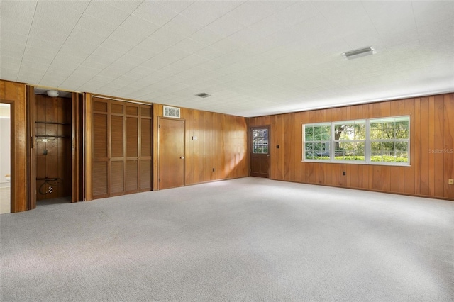 9223 Silver Lake Dr, Leesburg, FL 34788 - carpeted spare room with wood walls