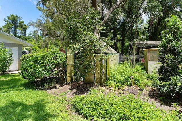 9223 Silver Lake Dr, Leesburg, FL 34788 - view of yard with a greenhouse and an outbuilding