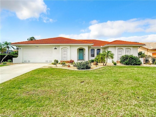 3723 Toulouse Ct, Punta Gorda, FL 33950 - mediterranean / spanish-style home with stucco siding, a tile roof, an attached garage, concrete driveway, and a front yard