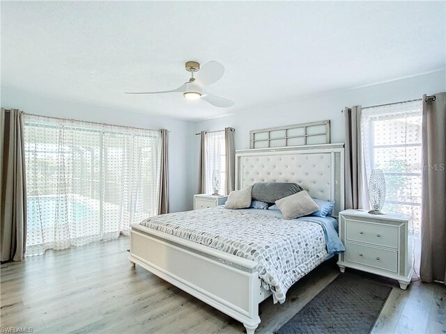 3723 Toulouse Ct, Punta Gorda, FL 33950 - bedroom featuring light wood-type flooring, multiple windows, and a ceiling fan