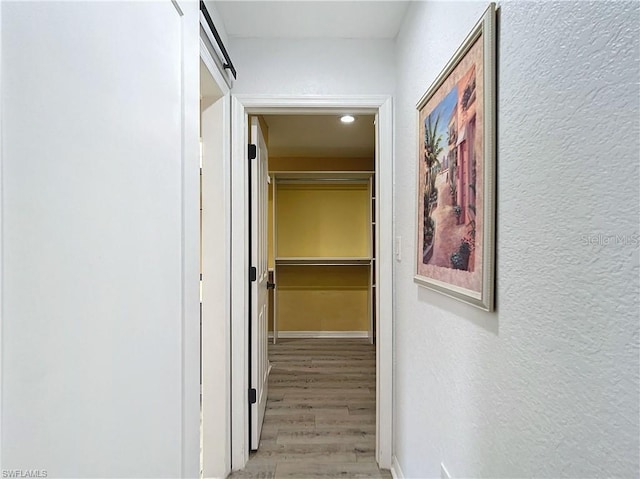 3723 Toulouse Ct, Punta Gorda, FL 33950 - corridor with a textured wall and light wood-style floors