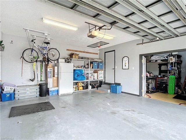 3723 Toulouse Ct, Punta Gorda, FL 33950 - garage with freestanding refrigerator and a garage door opener
