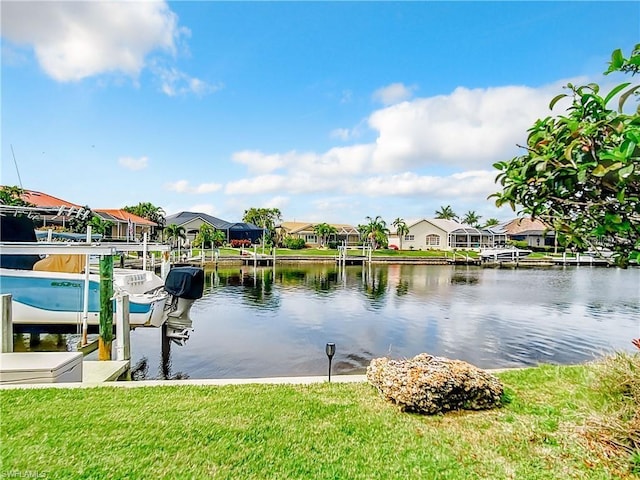3723 Toulouse Ct, Punta Gorda, FL 33950 - water view featuring boat lift, nearby suburban area, and a dock