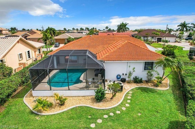 3723 Toulouse Ct, Punta Gorda, FL 33950 - rear view of property featuring a tiled roof, an outdoor pool, a residential view, stucco siding, and a patio area