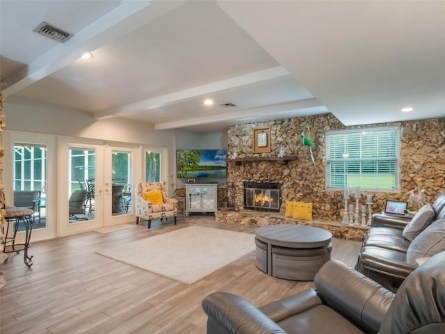 5556 Round Lake Rd, Apopka, FL 32712 - living area with french doors, beamed ceiling, wood finished floors, and a fireplace
