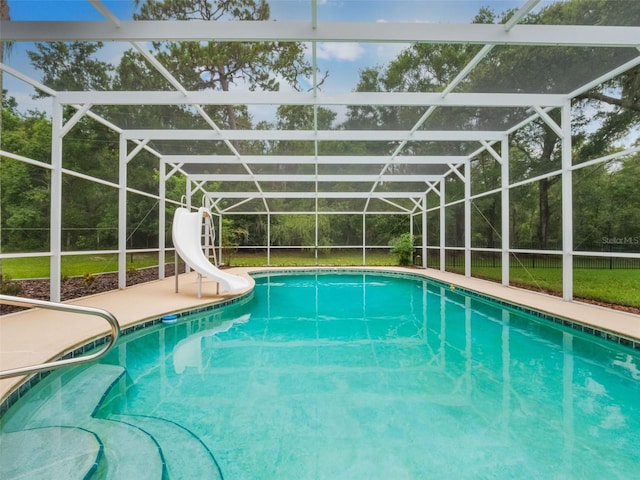 5556 Round Lake Rd, Apopka, FL 32712 - swimming pool with a water slide, a lanai, and a patio
