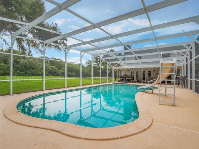 5556 Round Lake Rd, Apopka, FL 32712 - view of pool with a water slide, a patio area, a lawn, and glass enclosure