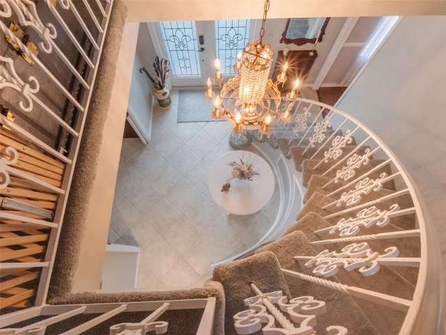 5556 Round Lake Rd, Apopka, FL 32712 - stairs with a chandelier and tile patterned flooring