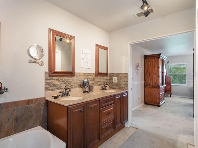 5556 Round Lake Rd, Apopka, FL 32712 - full bath with double vanity, a bathtub, and tasteful backsplash