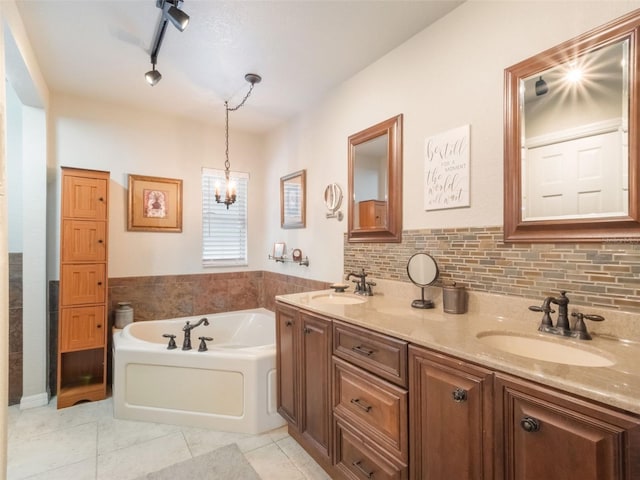 5556 Round Lake Rd, Apopka, FL 32712 - bathroom with tile patterned flooring, a garden tub, double vanity, and backsplash