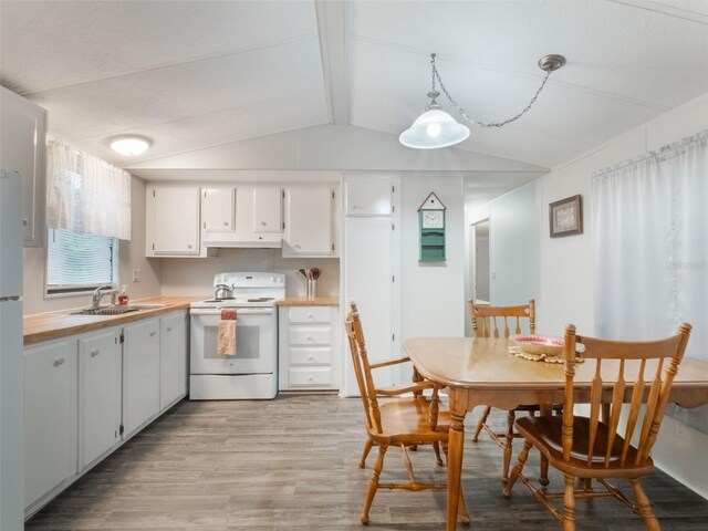 5556 Round Lake Rd, Apopka, FL 32712 - kitchen featuring white appliances, light wood-style flooring, white cabinetry, under cabinet range hood, and hanging light fixtures