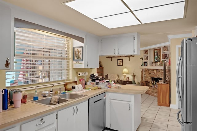 806 Leopard Trl, Winter Springs, FL 32708 - kitchen featuring appliances with stainless steel finishes, a peninsula, light tile patterned floors, and light countertops