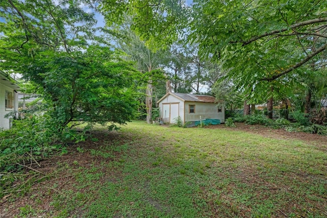 806 Leopard Trl, Winter Springs, FL 32708 - view of green lawn with a storage shed