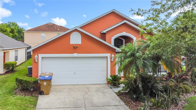 167 Castaway Beach Way, Kissimmee, FL 34746 - traditional-style house with driveway, stucco siding, and a garage