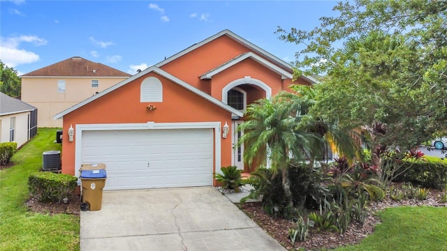 167 Castaway Beach Way, Kissimmee, FL 34746 - view of front facade with stucco siding, concrete driveway, a front yard, and an attached garage