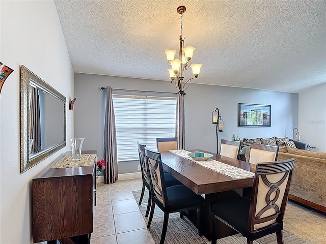 167 Castaway Beach Way, Kissimmee, FL 34746 - dining area with a chandelier, a textured ceiling, and light tile patterned flooring