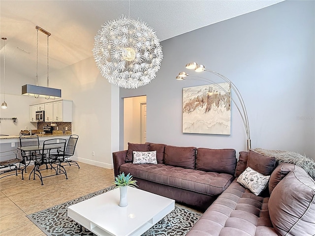 167 Castaway Beach Way, Kissimmee, FL 34746 - living area with light tile patterned flooring and a chandelier