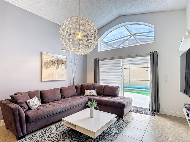 167 Castaway Beach Way, Kissimmee, FL 34746 - living area featuring lofted ceiling, light tile patterned floors, and a textured ceiling