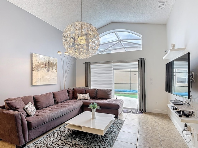 167 Castaway Beach Way, Kissimmee, FL 34746 - living room featuring lofted ceiling, light tile patterned floors, and a textured ceiling