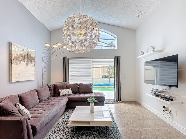 167 Castaway Beach Way, Kissimmee, FL 34746 - living area with a textured ceiling, light tile patterned floors, a chandelier, and vaulted ceiling