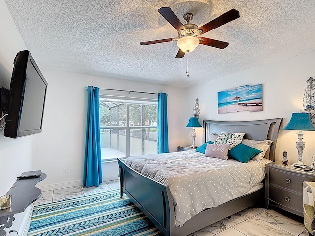 167 Castaway Beach Way, Kissimmee, FL 34746 - bedroom with light marble finish floors, a textured ceiling, and a ceiling fan