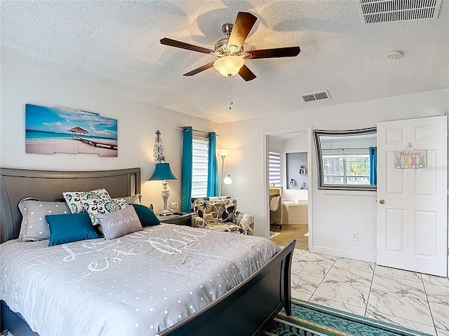 167 Castaway Beach Way, Kissimmee, FL 34746 - bedroom with multiple windows, a textured ceiling, marble look tiles, a ceiling fan, and ensuite bath