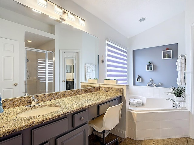167 Castaway Beach Way, Kissimmee, FL 34746 - bathroom featuring a stall shower, a bath, vanity, vaulted ceiling, and tile patterned floors