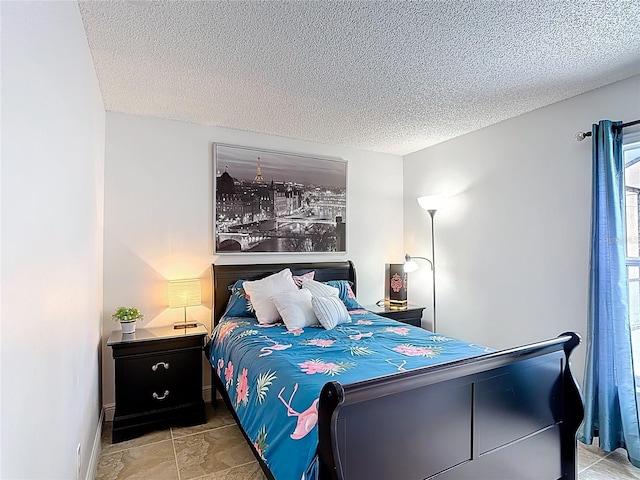 167 Castaway Beach Way, Kissimmee, FL 34746 - bedroom with a textured ceiling and baseboards