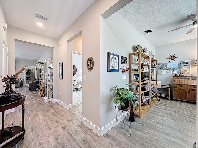 655 Conservation Blvd, Groveland, FL 34736 - corridor with wood tiled floors and a textured ceiling
