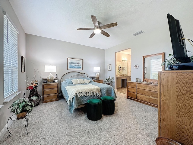 655 Conservation Blvd, Groveland, FL 34736 - bedroom featuring light carpet, multiple windows, and a ceiling fan