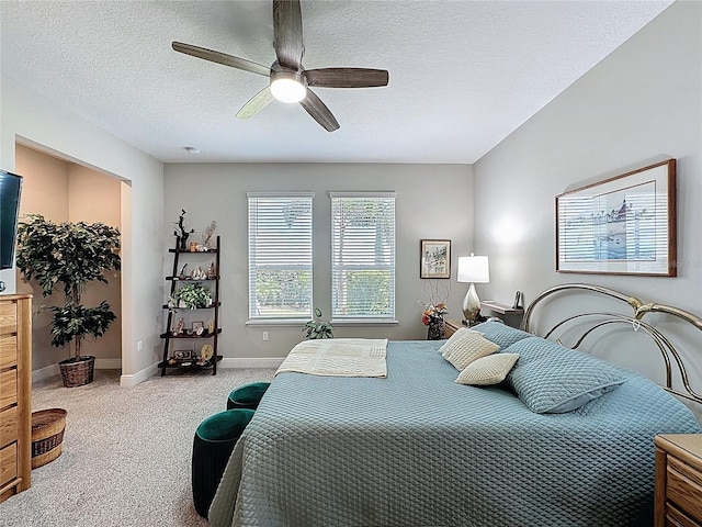 655 Conservation Blvd, Groveland, FL 34736 - carpeted bedroom with a spacious closet, a textured ceiling, ceiling fan, and a closet