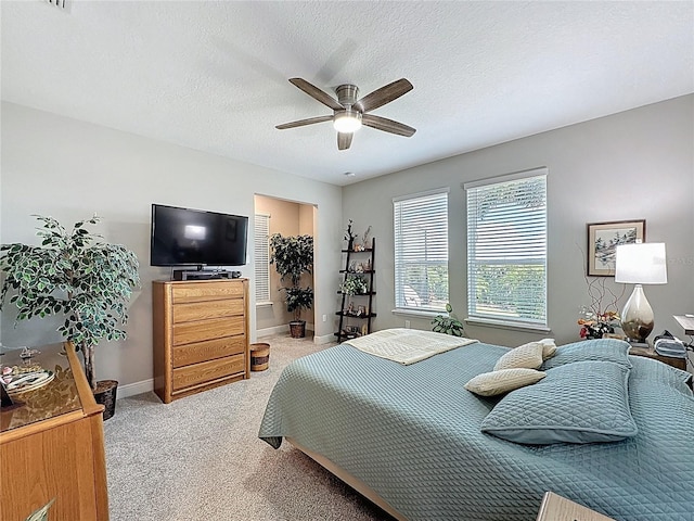 655 Conservation Blvd, Groveland, FL 34736 - bedroom featuring carpet flooring, a ceiling fan, a textured ceiling, and a spacious closet