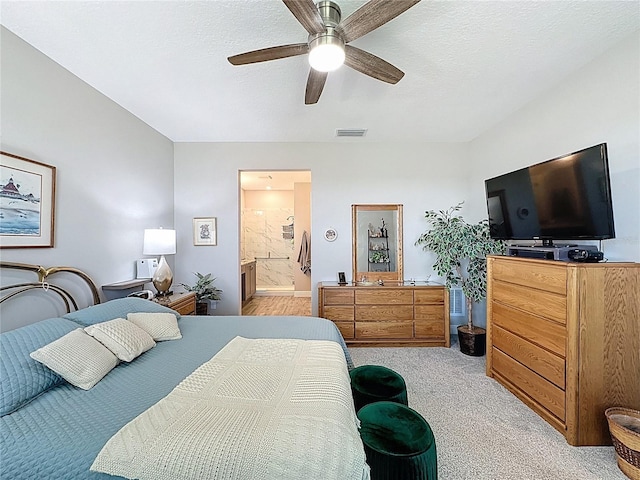 655 Conservation Blvd, Groveland, FL 34736 - bedroom featuring light colored carpet, ceiling fan, and ensuite bath
