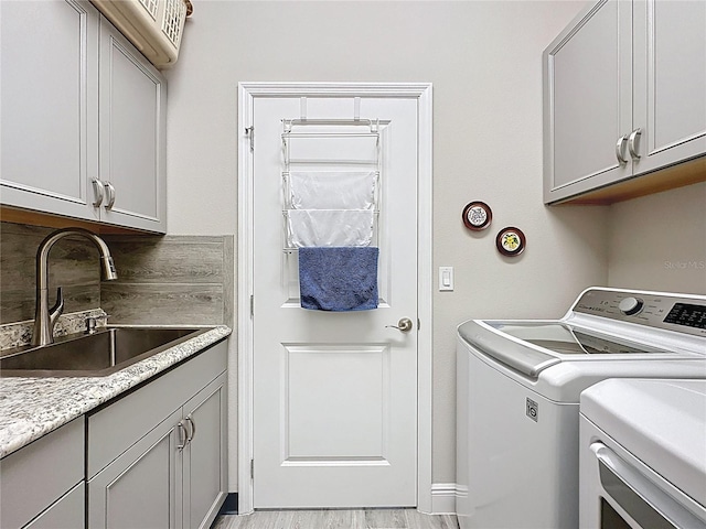 655 Conservation Blvd, Groveland, FL 34736 - laundry room featuring washer and dryer and cabinet space