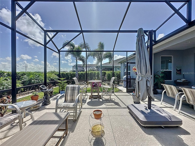 655 Conservation Blvd, Groveland, FL 34736 - view of patio featuring a lanai and outdoor dining area