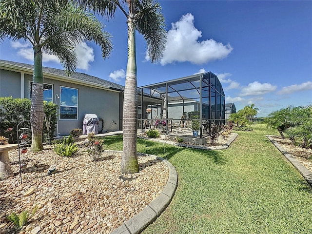 655 Conservation Blvd, Groveland, FL 34736 - view of green lawn with a patio and a lanai