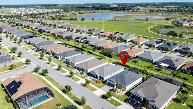 655 Conservation Blvd, Groveland, FL 34736 - aerial perspective of suburban area with a nearby body of water