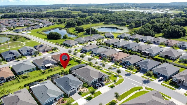 655 Conservation Blvd, Groveland, FL 34736 - aerial perspective of suburban area with a nearby body of water