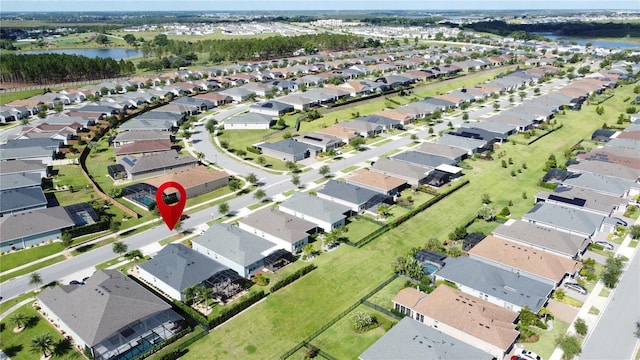 655 Conservation Blvd, Groveland, FL 34736 - aerial view of property and surrounding area featuring a nearby body of water and nearby suburban area