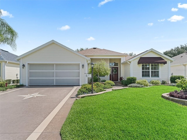 487 Thistledown Way, The Villages, FL 32162 - ranch-style home featuring a front yard and a detached garage