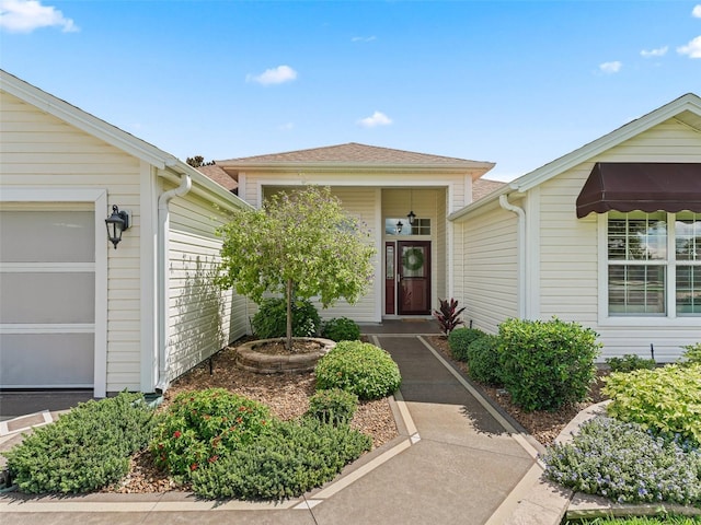 487 Thistledown Way, The Villages, FL 32162 - property entrance with an attached garage