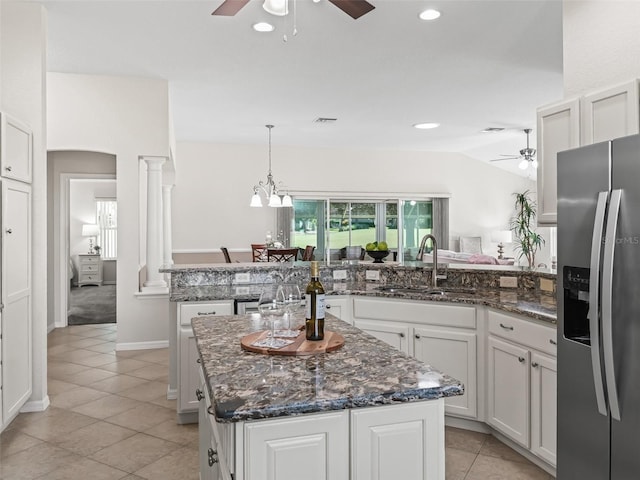 487 Thistledown Way, The Villages, FL 32162 - kitchen with stainless steel fridge with ice dispenser, ceiling fan, a center island, light tile patterned flooring, and recessed lighting