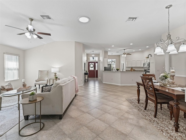 487 Thistledown Way, The Villages, FL 32162 - living room with a ceiling fan, recessed lighting, a chandelier, light tile patterned flooring, and lofted ceiling
