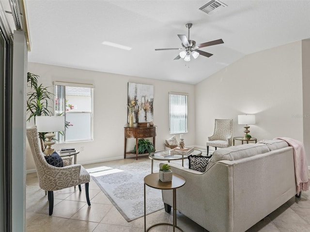 487 Thistledown Way, The Villages, FL 32162 - living area featuring lofted ceiling, a ceiling fan, plenty of natural light, and light tile patterned flooring