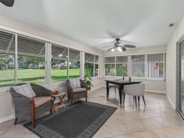 487 Thistledown Way, The Villages, FL 32162 - sunroom with ceiling fan and outdoor dining space
