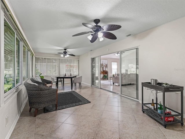 487 Thistledown Way, The Villages, FL 32162 - sunroom / solarium with healthy amount of natural light, a textured ceiling, and tile patterned flooring