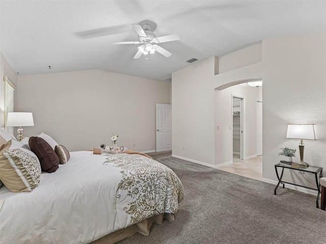 487 Thistledown Way, The Villages, FL 32162 - carpeted bedroom with arched walkways, vaulted ceiling, and a ceiling fan