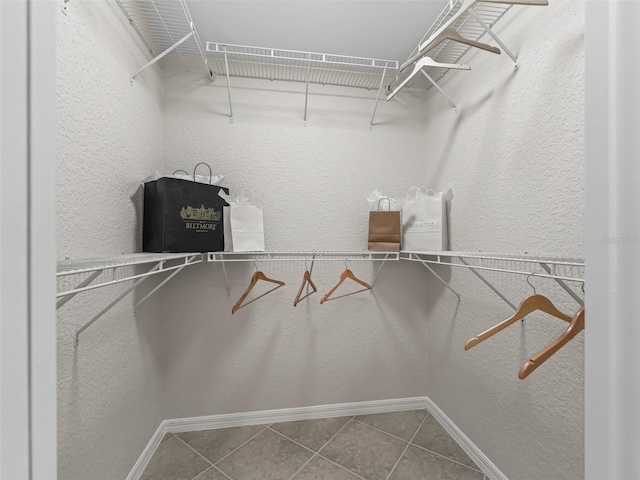 487 Thistledown Way, The Villages, FL 32162 - walk in closet with tile patterned floors