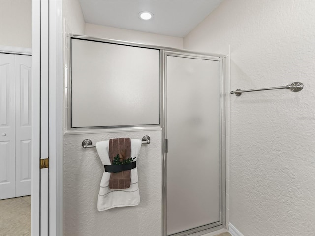 487 Thistledown Way, The Villages, FL 32162 - full bathroom with a textured wall, a shower stall, a closet, and recessed lighting